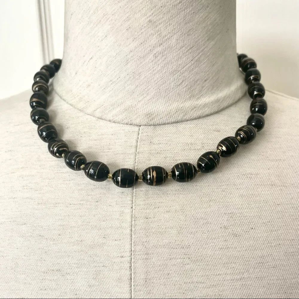 Black and gold swirl oval beaded necklace